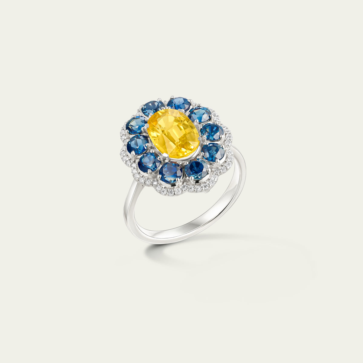 Close view of the Marigold Hero I Ring in 18K white gold, blue and yellow sapphire and diamond