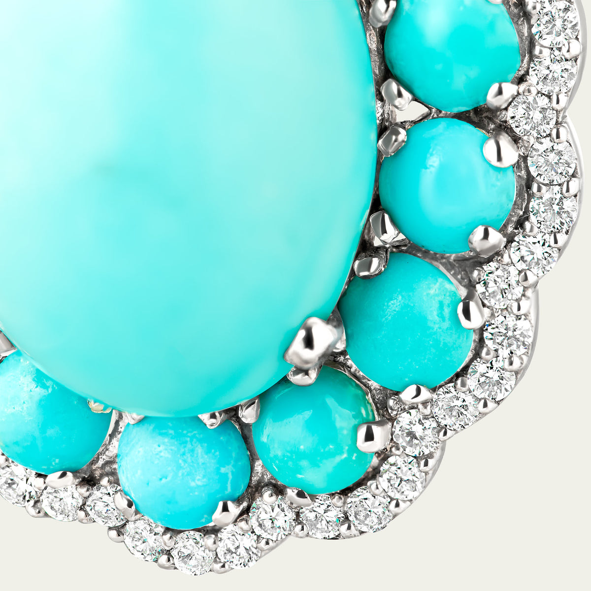 Close view of the Marigold Firoza Earrings in 18K white gold, turquoise and cabochon blue sapphire and diamond
