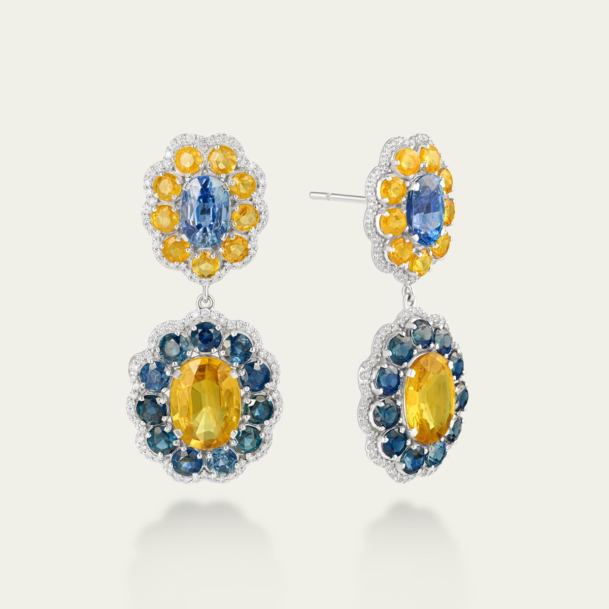 Marigold Hero I Earrings in 18K white gold, set with blue and yellow sapphire and diamond