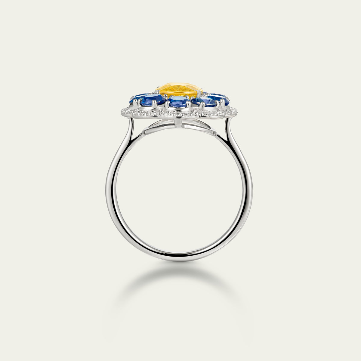 Close view of the Marigold Hero I Ring in 18K white gold, blue and yellow sapphire and diamond