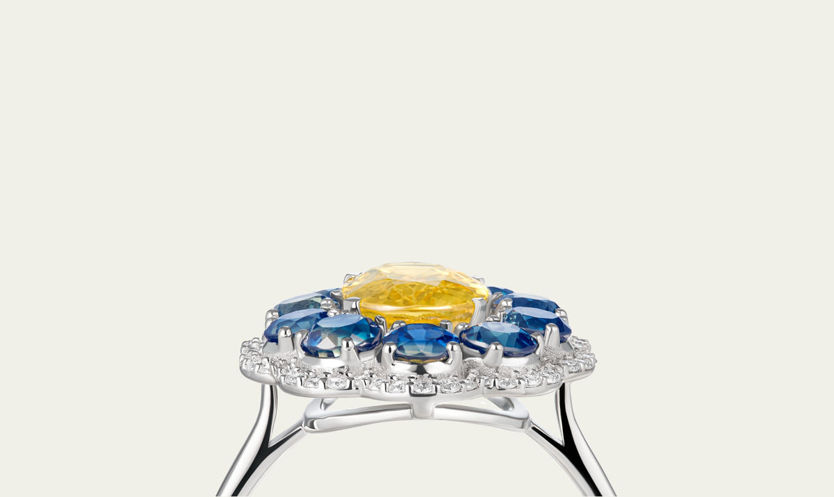 Close view of the Marigold Hero I Ring in 18K white gold, blue and yellow sapphire and diamond