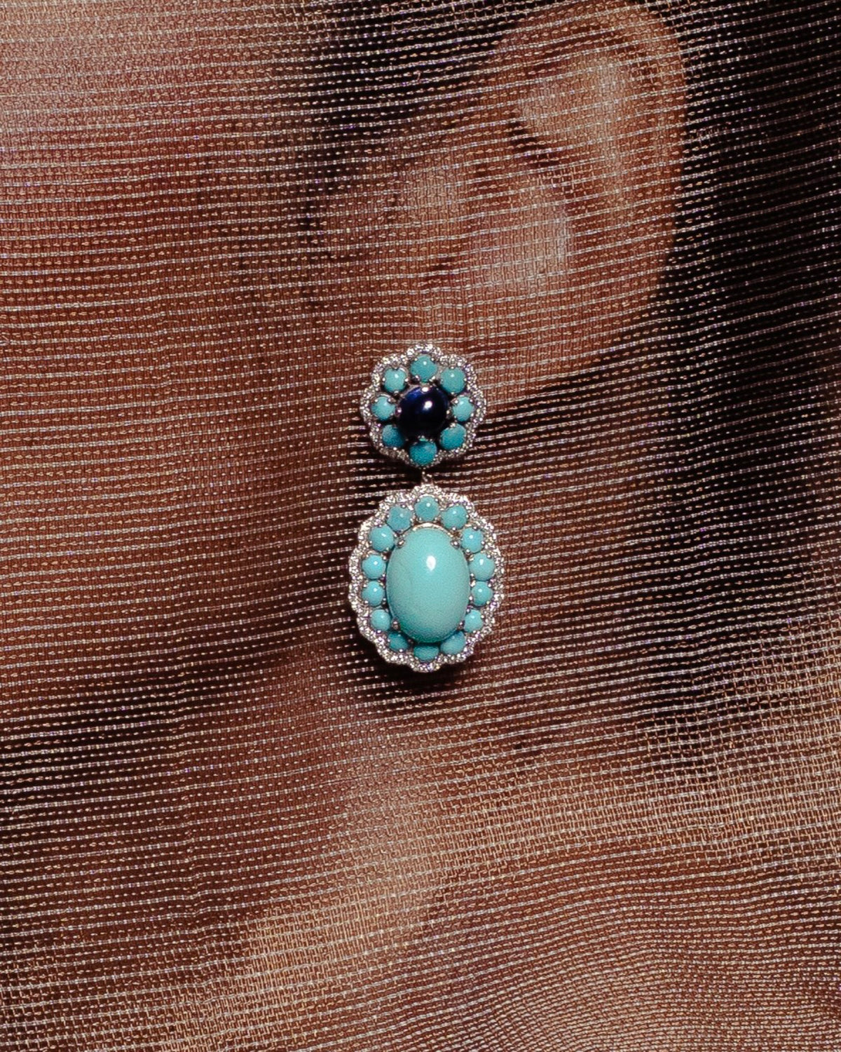 Close view of the Marigold Firoza Earrings in 18K white gold, turquoise and cabochon blue sapphire and diamond