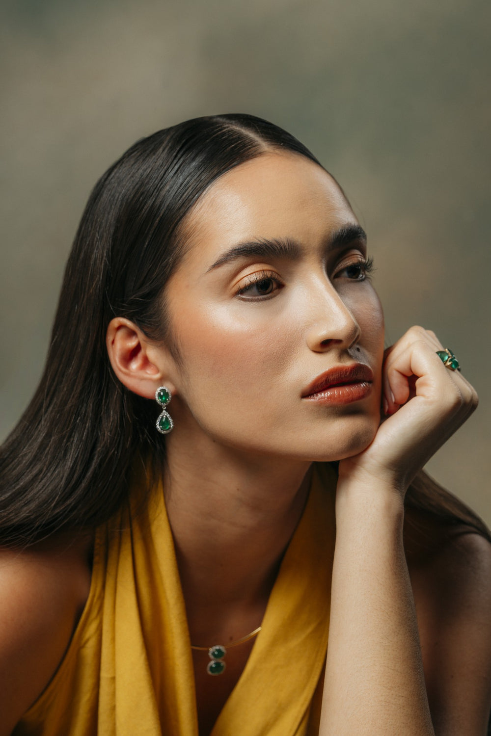 Emerald Silk Cabochon Drop Earrings on the model